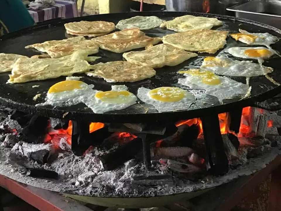Roti Canai Kayu Arang is cooked with Kayu Arang (Charcoal)